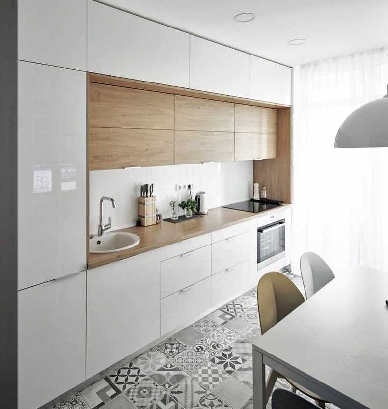 Белая кухня с черной столешницей: выбор стиля оформления и материалов